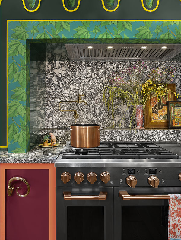 matte black range, hood, and french-door refrigerator in kitchen with navy cabinets