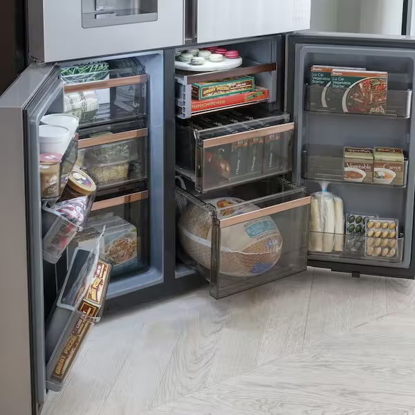 Quad door refrigerator with the bottom doors open