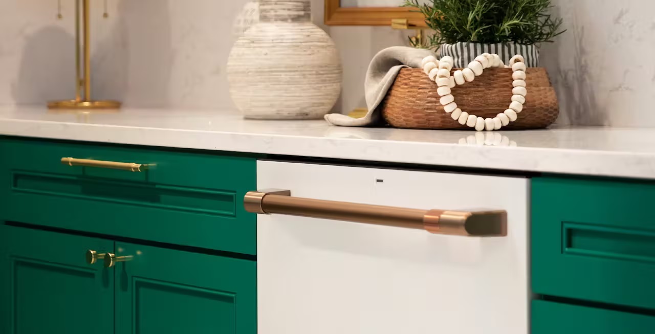 Matte White dishwasher in dark green cabinets