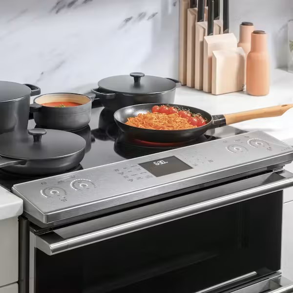 Induction range with pans on cooktop