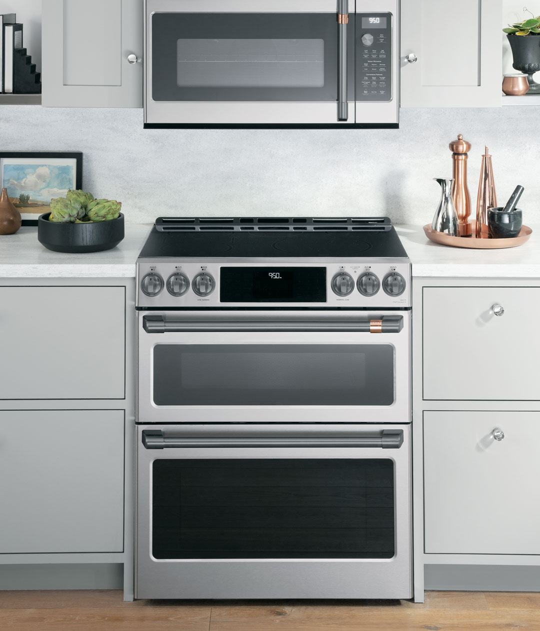 stainless steel double oven range with grey cabinets