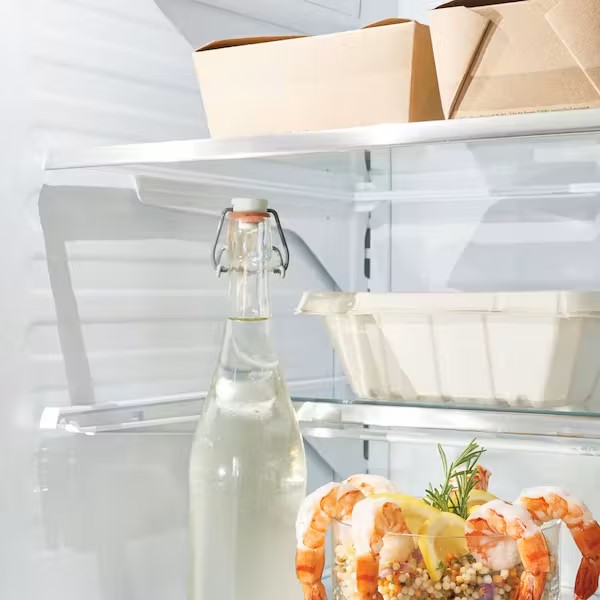 leftovers on top shelf in refrigerator